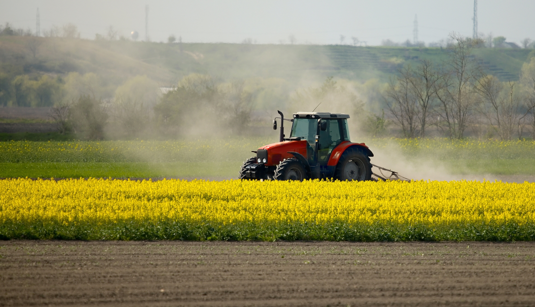 Agricultural tractor representing Cablecraft control cable and actuation applications for farm equipment